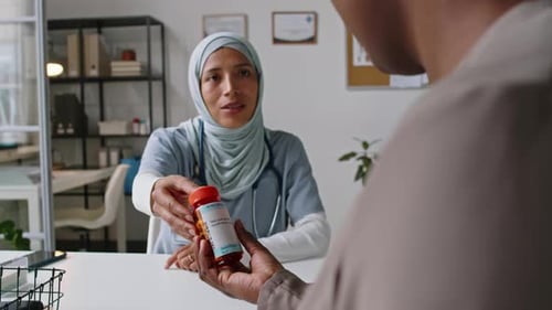 Doctor Explains Medication Prescription to Patient