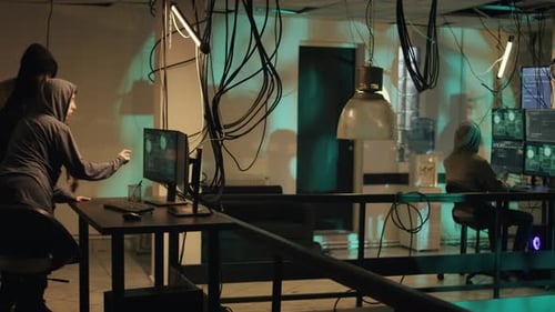Hackers Working Together in Dark Computer Room
