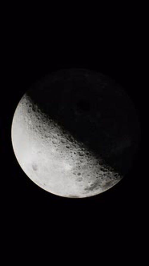 Glimpse of the Sunlit Portion of the Moon From Outer Space Vertical