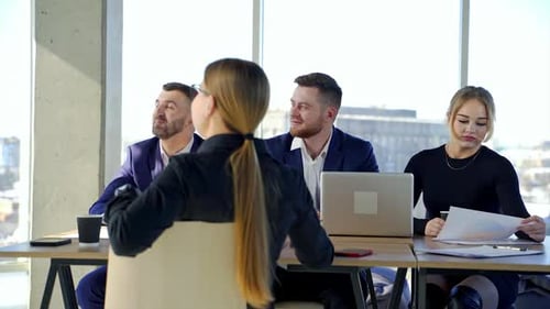 Young colleagues sitting at the business meeting in the office. Brainstorming at the office.