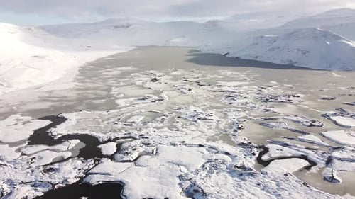 Icelandic Highland in Winter Season Frozen Rivers and Mountains Covered with Snow Aerial Flight