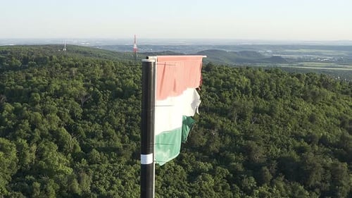 Hungarian Flag Waving on Hillside Aerial View