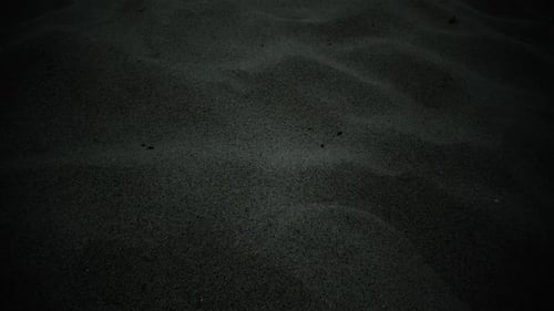 Textured Black Sand Close-Up