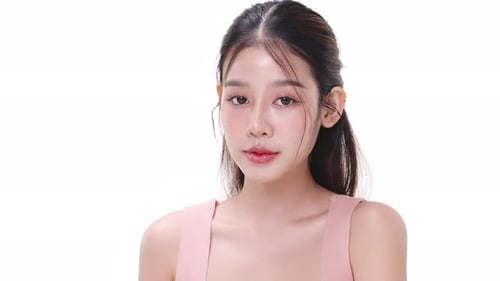 Close up portrait beautiful young Asian woman with healthy facial skin.