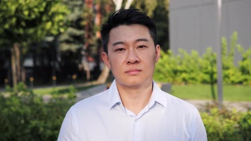 Portrait of Handsome Focused Concentrated Asian Businessman Manager CEO