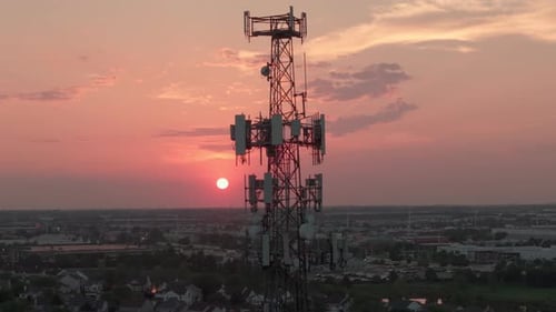 Television or Radio Telephone Tower in a Cityscape at Sunset Time Wide Aerial Drone Footage