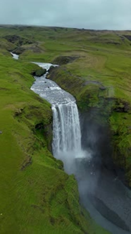 Dramatic Landscape of Skogafoss Waterfall Flowing From Volcanic Mountain in South of Iceland