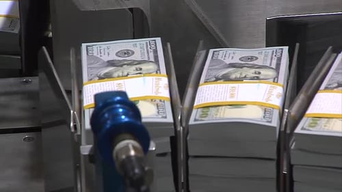 STACK OF 100 DOLLAR BILLS AT THE PRINTING PRESS