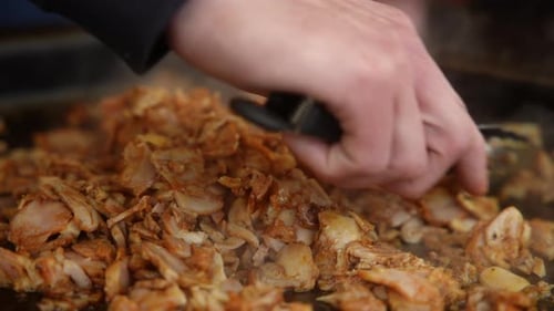 Seasoned Meat Cooking on Flat Top Grill