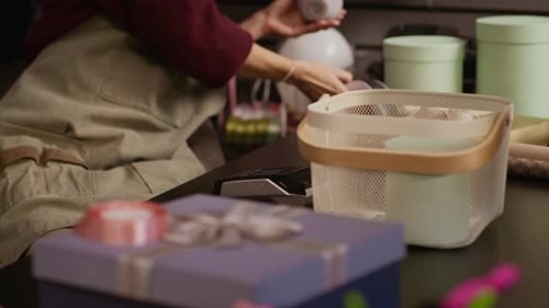 Worker Scanning Purchase of Customer in Gift Shop