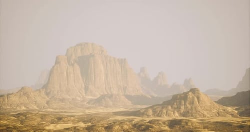 Majestic Rocky Formations Rise Above Arid Desert Landscape at Dusk