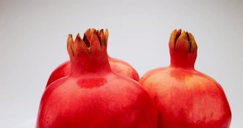 Pomegranates clustered together, ripe, tasty fruit