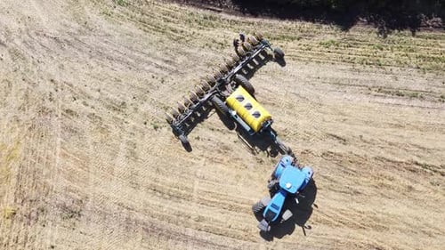 Blue Tractor O.A. Planting Canola On No Till Field