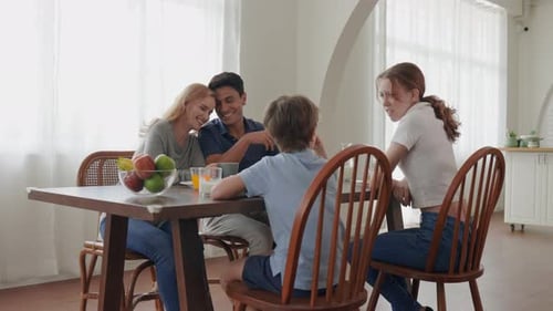 Family Enjoys Breakfast Together in a Light, Airy Home