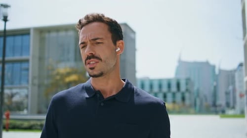 Focused Businessman Talking Earphones Crossing to Office Close Up Man Calling