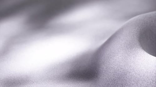 Delicate Silver Fabric Softly Rippling Creating Gentle Undulating Waves While Revealing Intricate