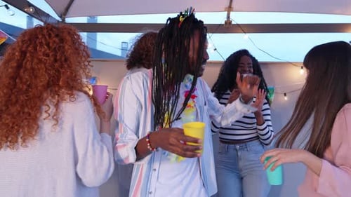 Young Adults Enjoying Birthday Party on Rooftop