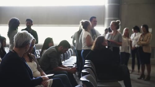 People Gather in a Brightly Lit Urban Space