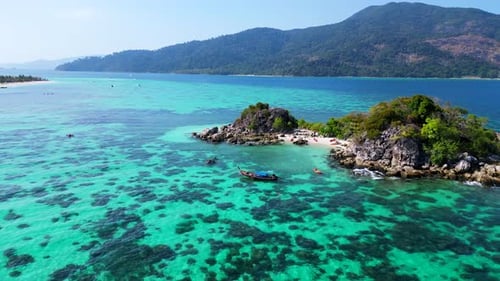 beach rocky cliff island turquoise blue sea. Magic aerial top view flight panorama orbit drone
4k fo