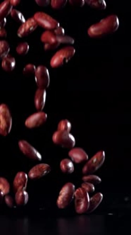 Red Beans Fall on the Table Filmed on a Highspeed Camera at 1000 Fps