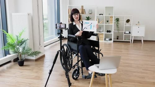 Business Woman Explaining Chart on Video Call