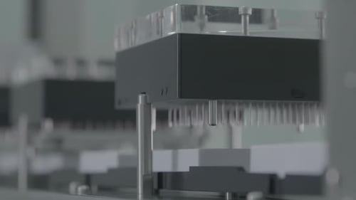 Robotic Arms Move in Automated Industrial Process