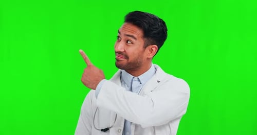 Pointing, doctor and Asian man with green screen, face and healthcare with announcement