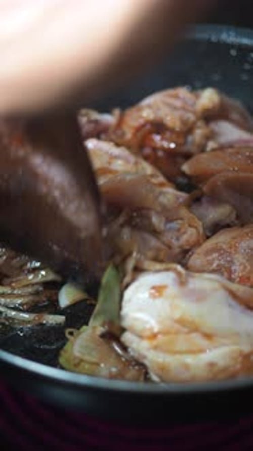 Chicken and Onion Stir Fry Cooking in Pan