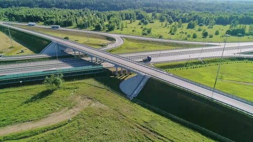 Transport Interchange on the Highway Aerial of Cars Drive Along the Highway Outside the City