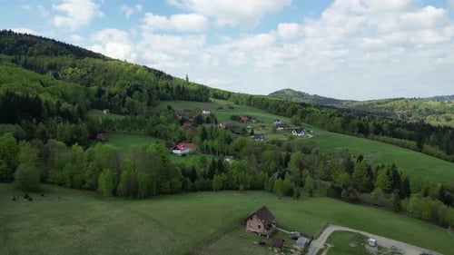 Mountain village in Beskid landscape - drone aerial 4K