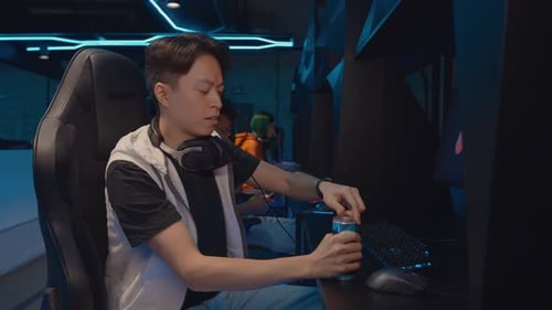 Gamers playing in a gaming room.