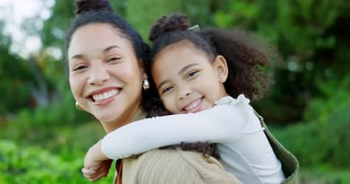 Affectionate Mother and Daughter Embrace Outdoors