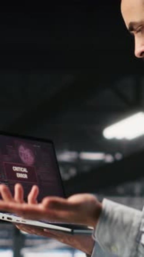 Vertical Video Annoyed Engineer in Data Center Reacting to Critical Error Message on Laptop
