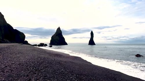 Explore the Stunning Reynisfjara Black Sand Beach in Iceland with Unique Rock Formations