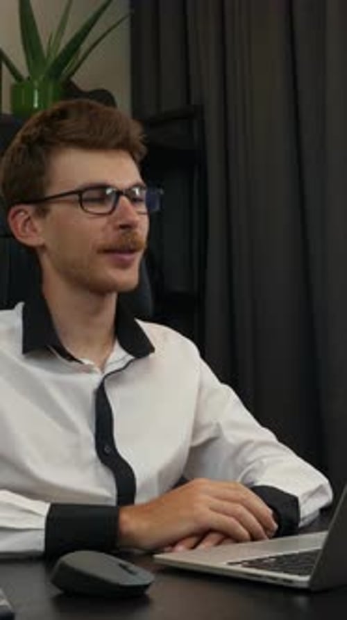 Young Man Talking During Video Conference On Laptop