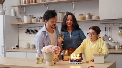 Happy Family Celebrating Birthday in Modern Kitchen
