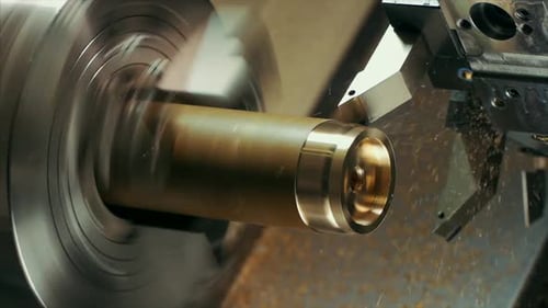 man is shaping copper in cnc machine.copper pieces in slow motion