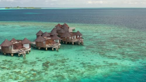 Luxury Overwater Bungalows Resort in Coral Reef Lagoon Ocean