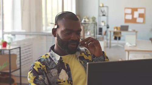 Call Centre Manager Speaking to Client in Office