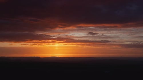 Golden Sunrise Over Distant Mountains, Aerial View