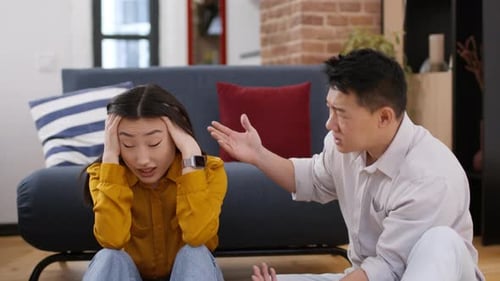 Man and Woman Arguing in a Home