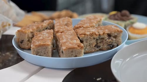 Delicious Bars with Chocolate Chips on Light Blue Plate