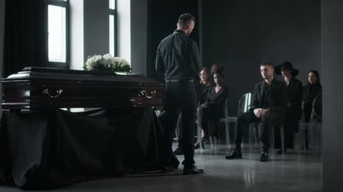 Priest Conducting Funeral, While Seated Mourners Observing in Quiet Grief