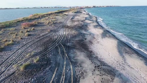 Bird's Eye View of Beach with Sand Grass and Stones Washed By Bay of Black Sea and Lake Under Sky in