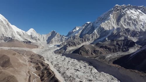 Aerial View of a Majestic Glacier Nestled in the Himalayas of Nepal Showcasing Snowcapped Peaks and