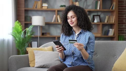 Woman Shopping Online with Credit Card and Phone