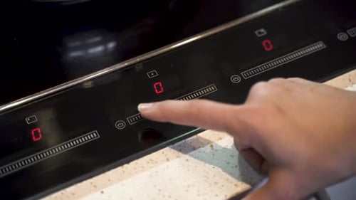 Finger Turns On Induction Cooktop to High