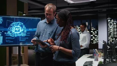 Engineering Team in Office Analyzing Machine Learning Algorithms Using Devices