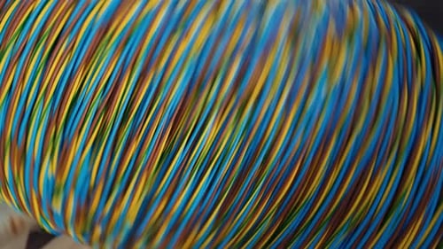 Winding of the electrical cable to the bobbin in the production. Cable production. cable factory. 4K