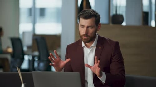 Confident Ceo Conducting Video Meeting Using Laptop at Modern Office Closeup